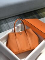高仿網站Hermes愛馬仕新款日落橙gard party花園包手提包30CM